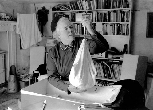 Nurse Mary Woods weighing a new baby, Addisford, Devon 1980